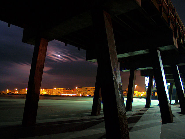 Night scene through wooden beams